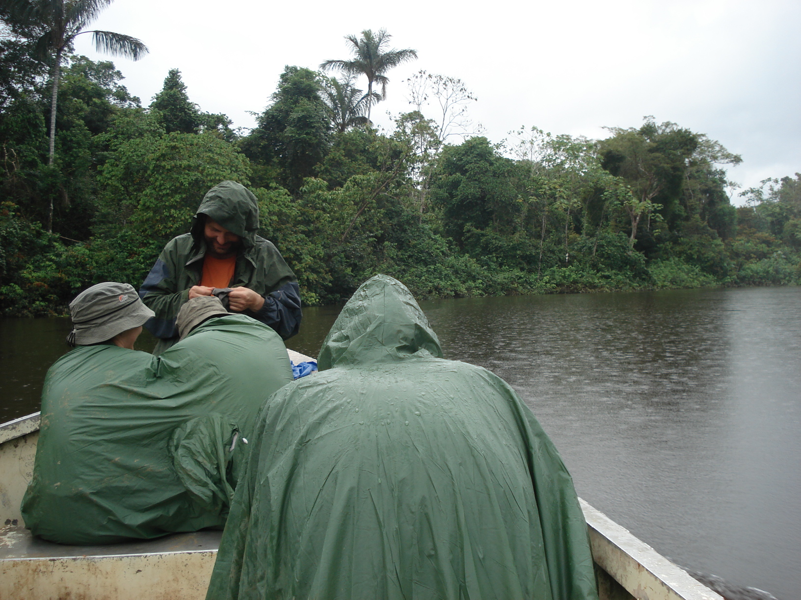 Visitors exploring the Amazon rainforest waterways by canoe during a jungle tour in Peru.