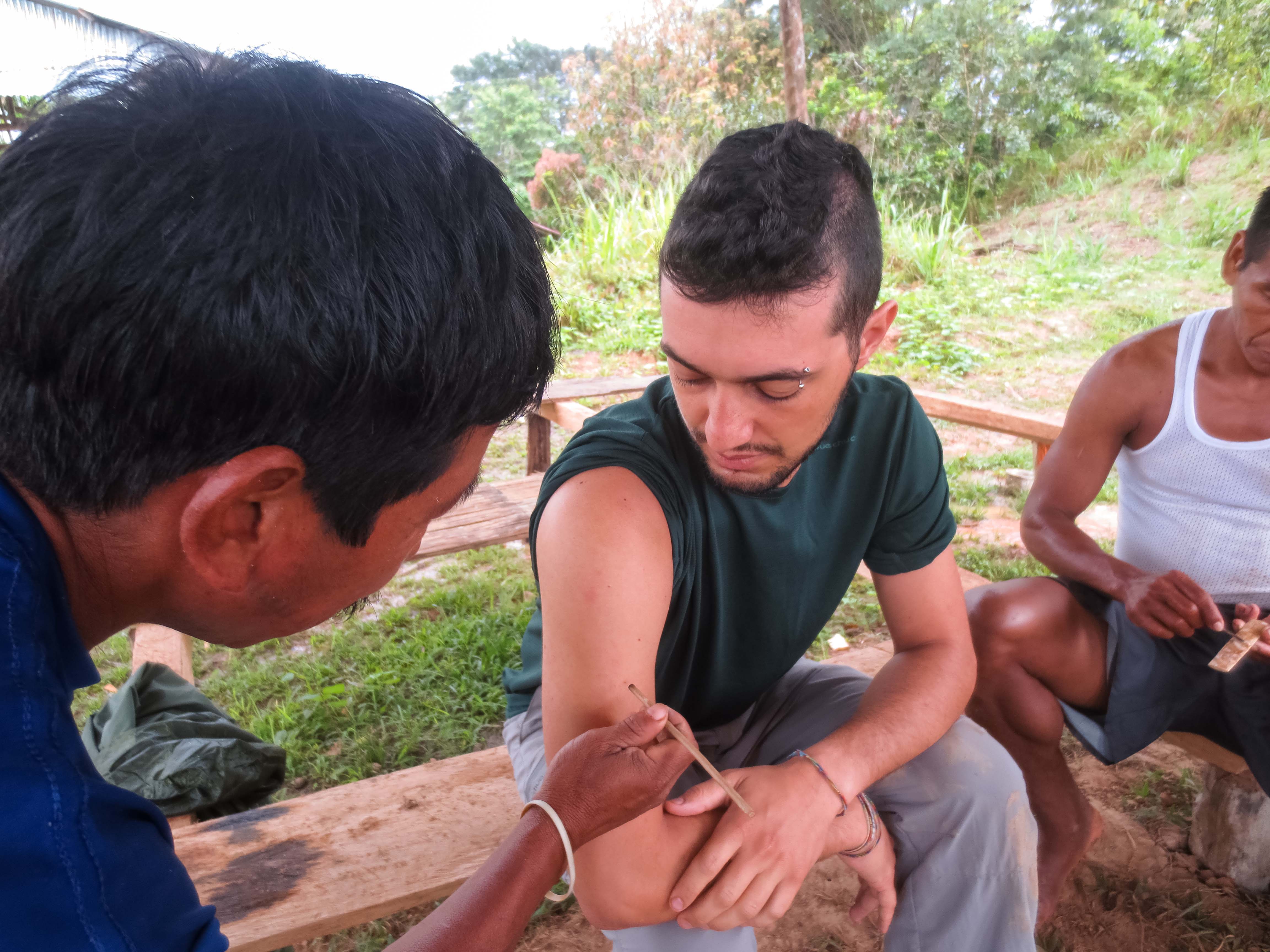 A visitor participating in an Amazon rainforest research activity near Selva Wild Lodge in Peru.